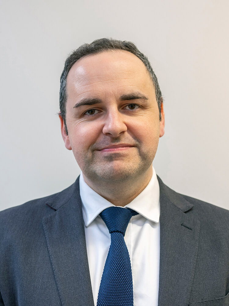 Letters on cork board spelling out IMPACT